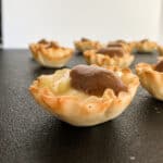 Phyllo tartlet shell with melted brie and apple butter.