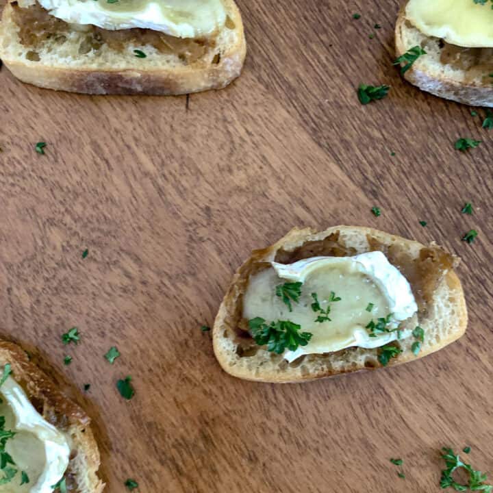 Caramelized onions and melted brie on a crostini.