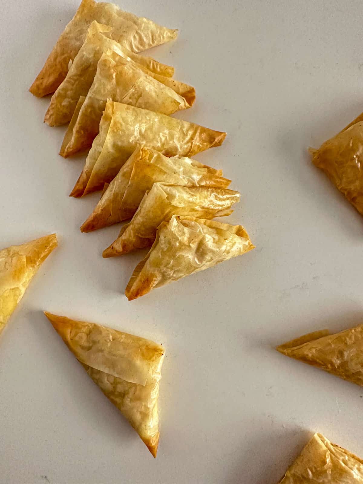 Crispy golden, feta, hot honey, triangle phyllo bites.