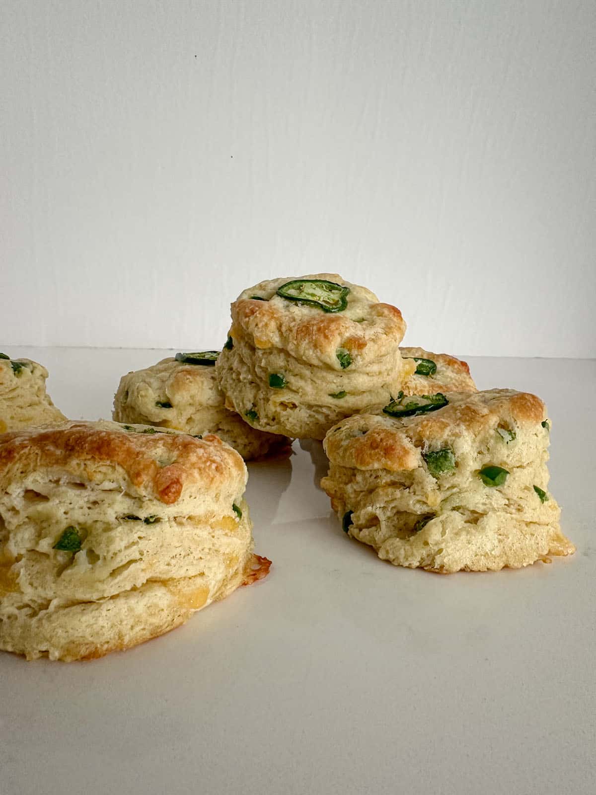 Cheddar and jalapeño biscuits on a board.