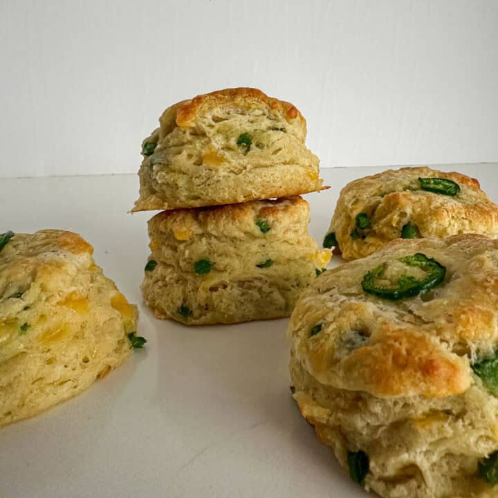 Cheddar jalapeño biscuits on a board.
