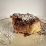 Apple streusel coffee cake on a plate with a fork.
