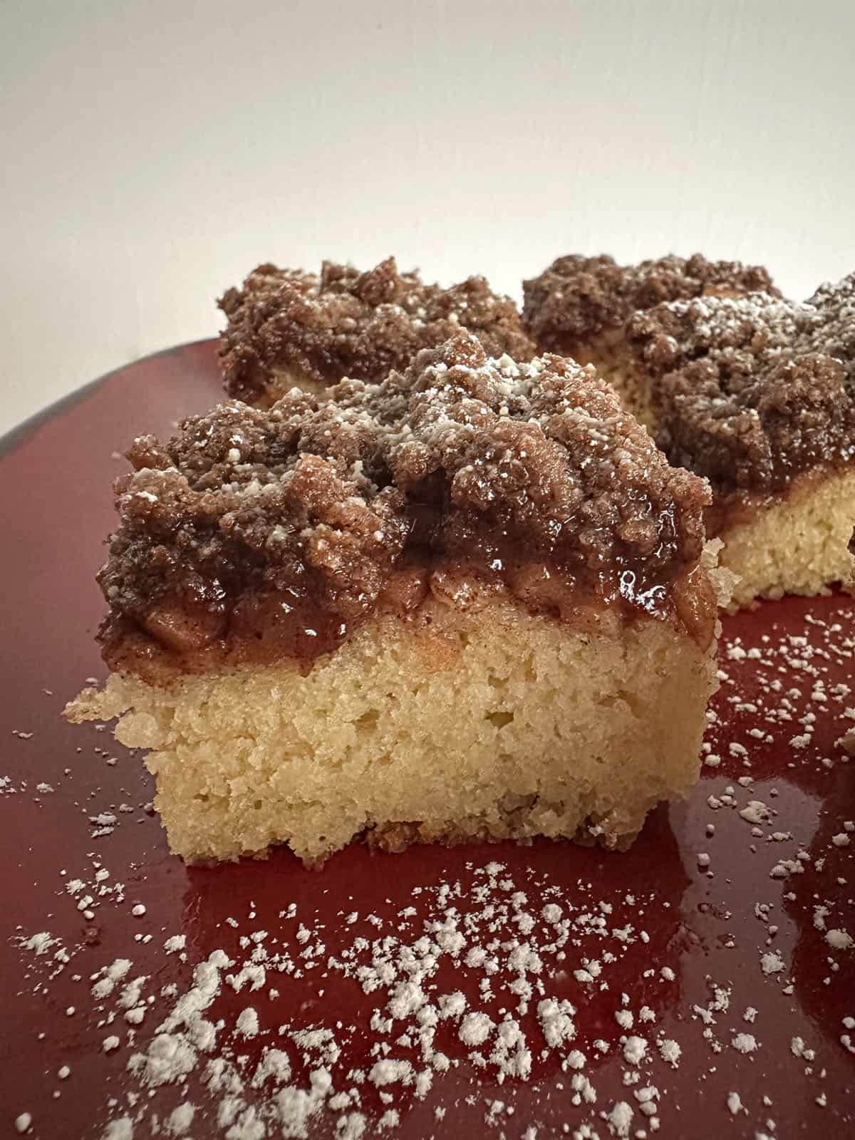Pieces of apple coffee cake on a platter.