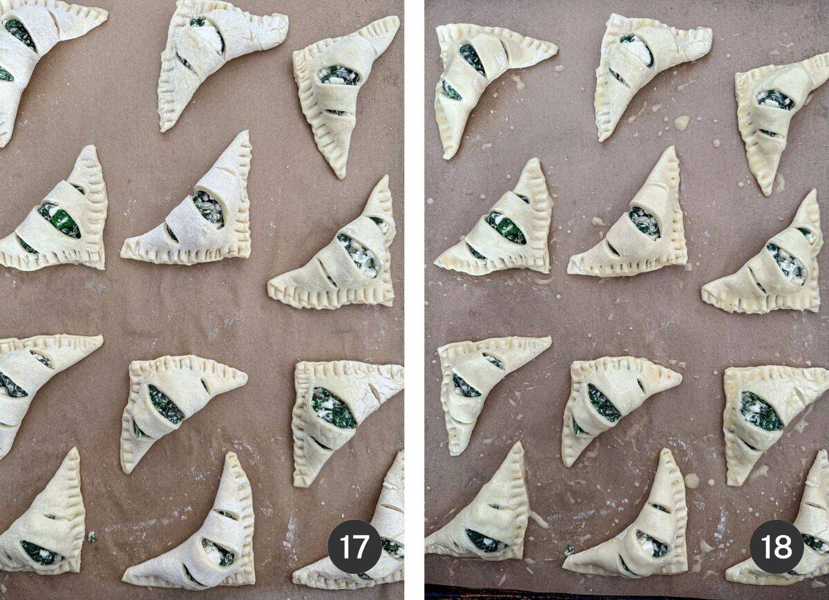 Unbaked, egg washed, stuffed puff pastry triangles on parchment lined baking sheet.