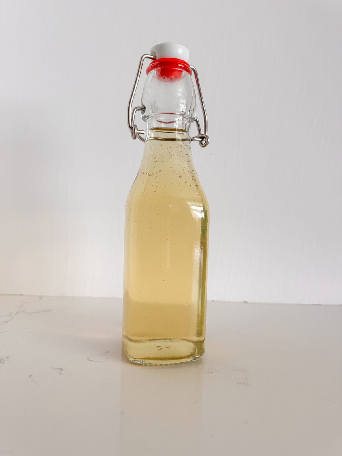 A bottle of mint simple syrup.