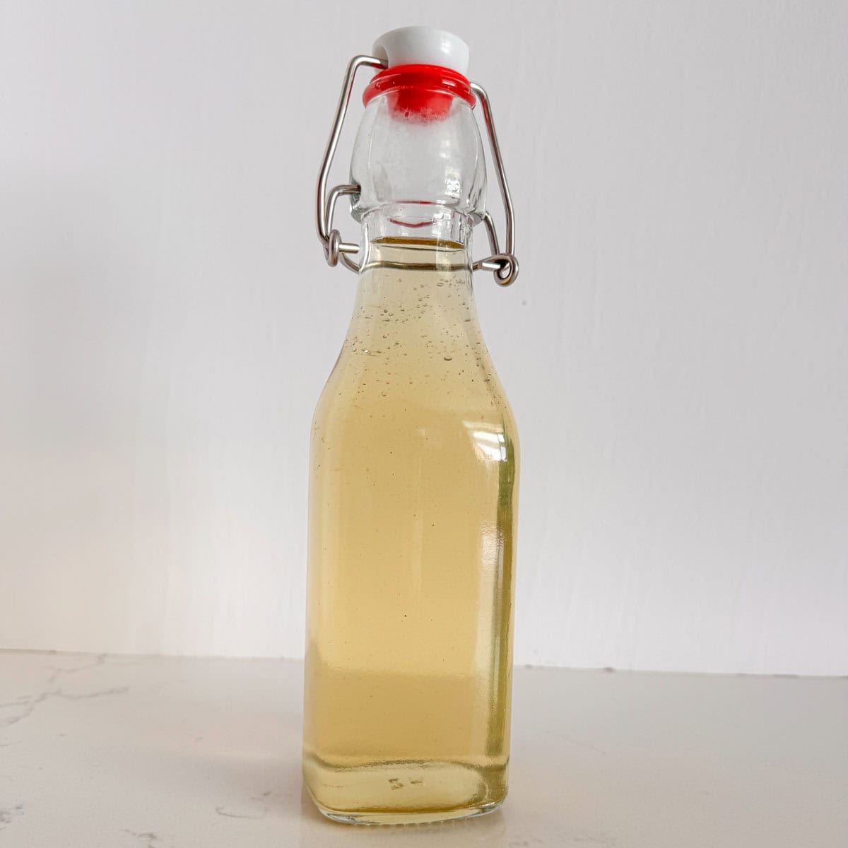 A bottle of mint simple syrup.