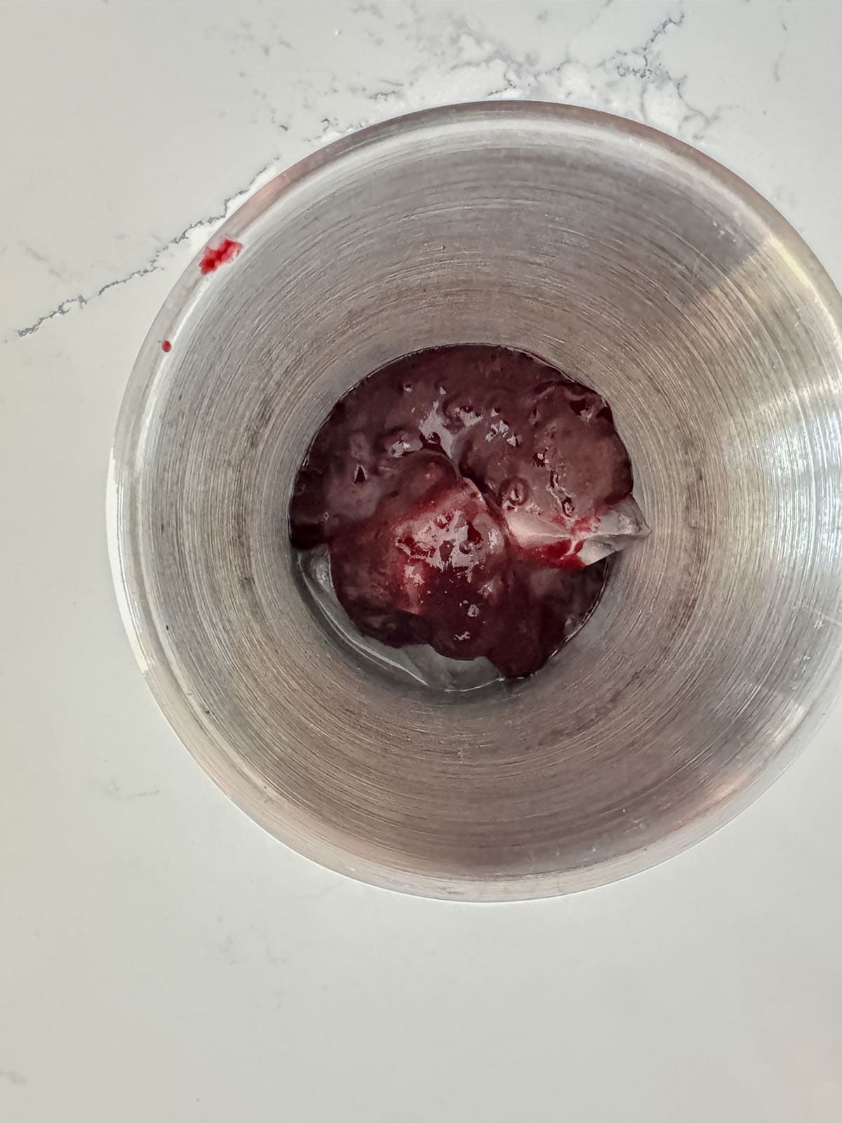 Blueberry puree, lime juice in cocktail shaker.