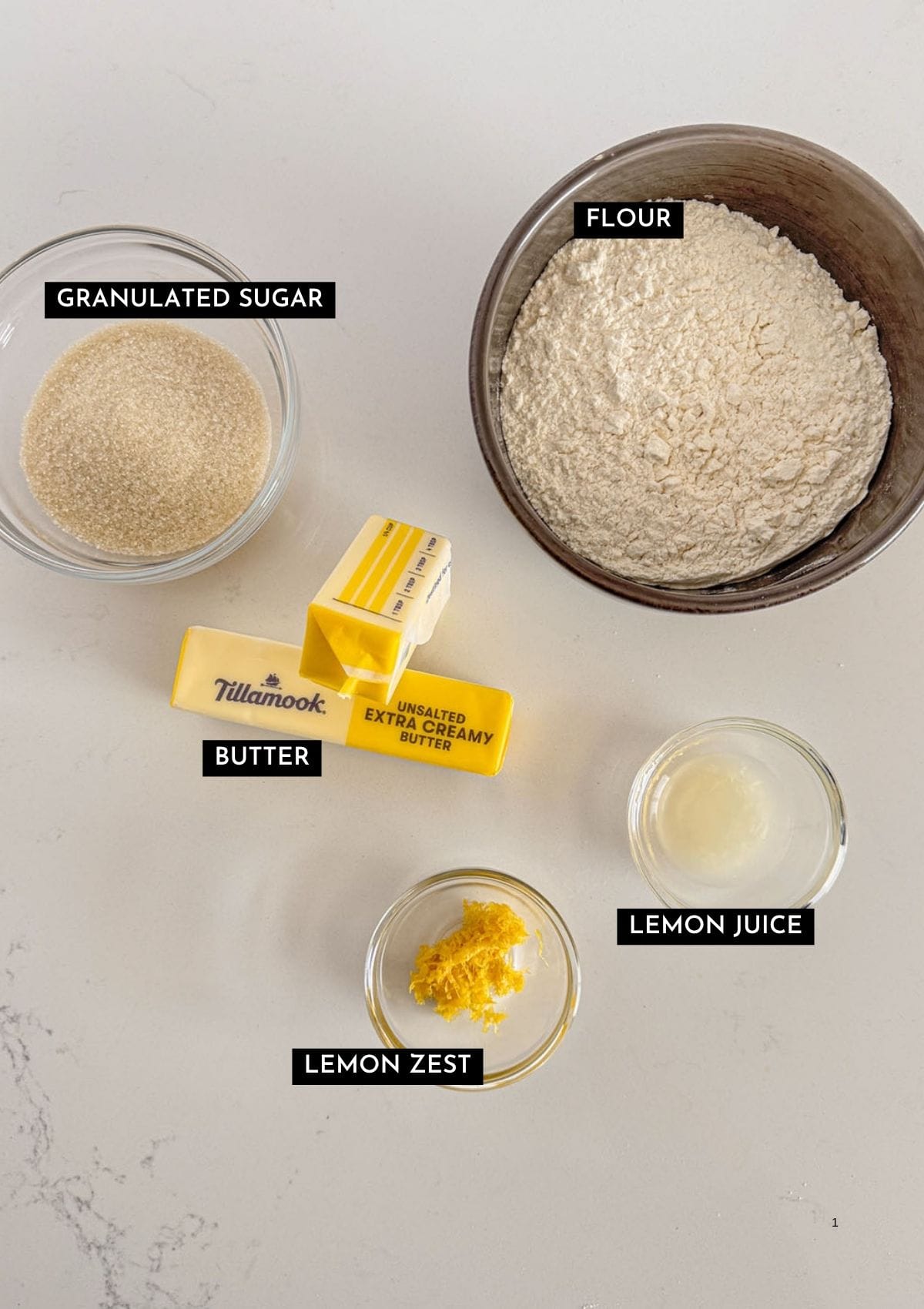 Butter, flour, sugar, lemon zest, and lemon juice in individual bowls.