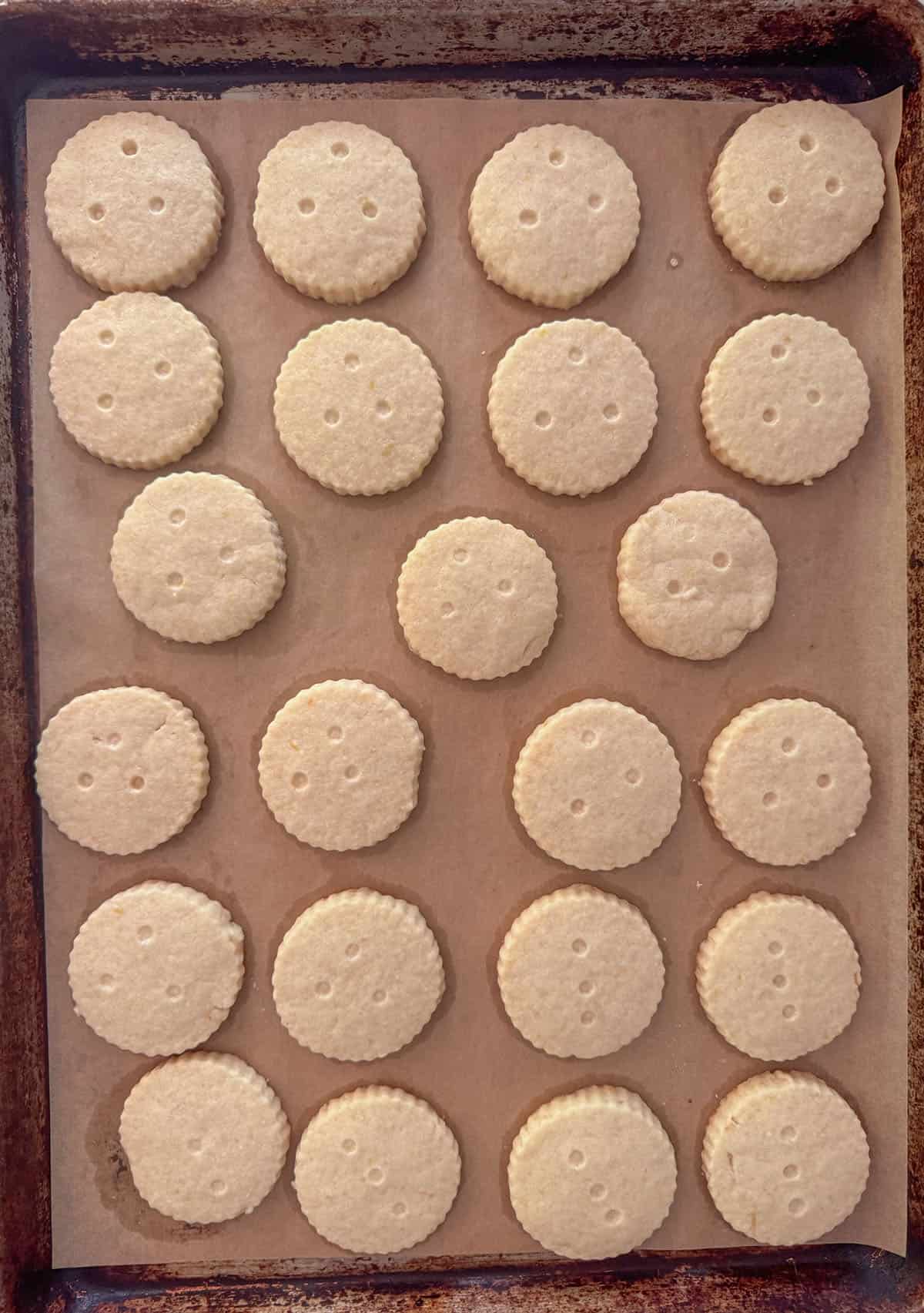 Baked shortbread cookies on a sheet pan.